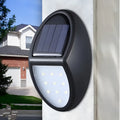 Black solar-powered LED wall light with solar panel and motion sensor