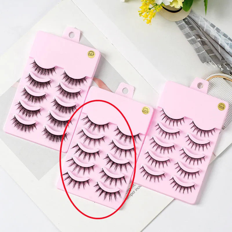 5 pairs of manga-style false eyelashes on a black strip, showing natural wispy Korean makeup look.