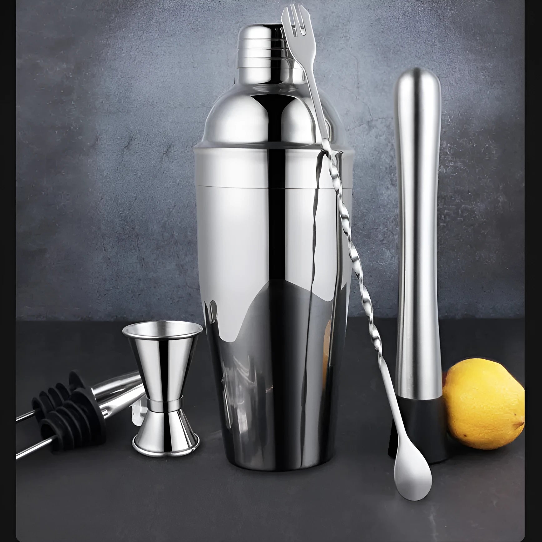 23-piece stainless steel cocktail set with acrylic mixing components on bar counter