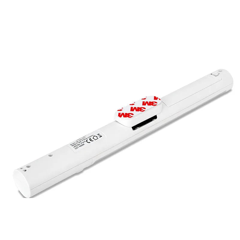 Slim white human induction cabinet wall light with magnetic back for installation on metal surfaces