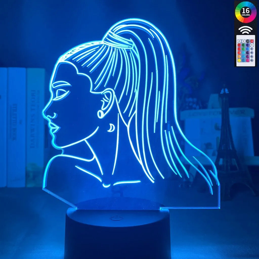 Slim white acrylic 3D decorative night light with LED illumination and remote control on a table.