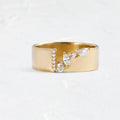 Gold electroplated copper ring with shining zircon details showing side profile view