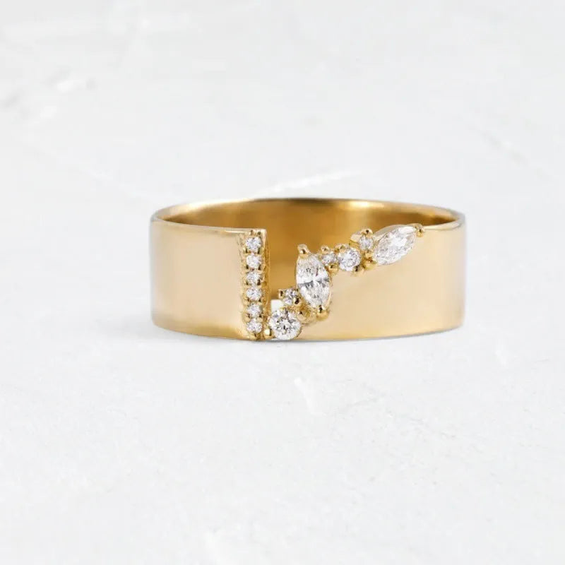 Gold electroplated copper ring with shining zircon details showing side profile view