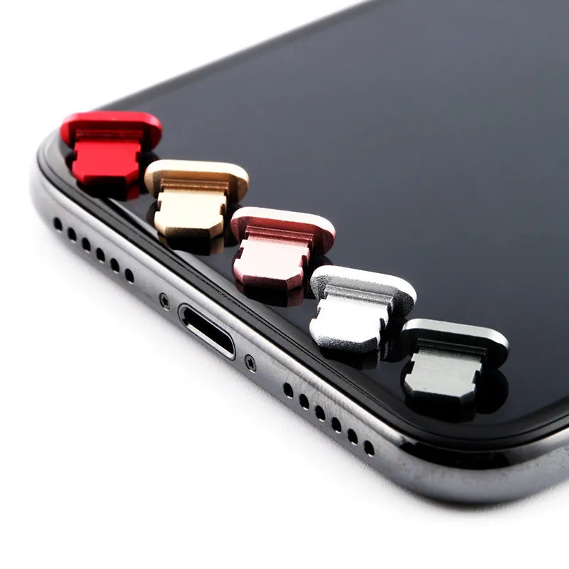 Aluminium alloy dust plug for iPhone charging port in various colours including gold, silver, and rose gold.