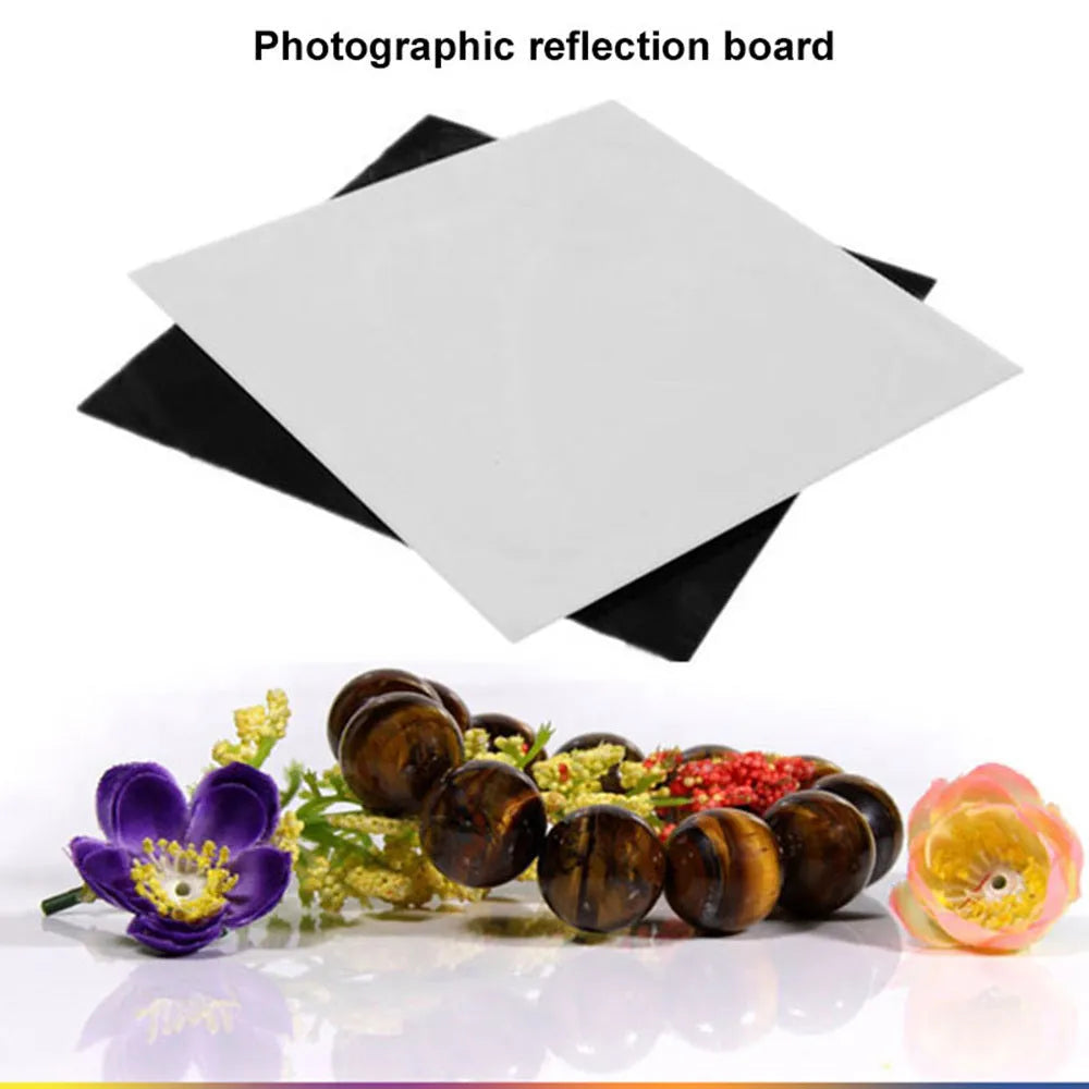 Black and white acrylic square reflection boards for product photography on a table