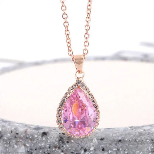 Women's rose gold electroplated rhinestone necklace with geometric water drop pendant in pink colour