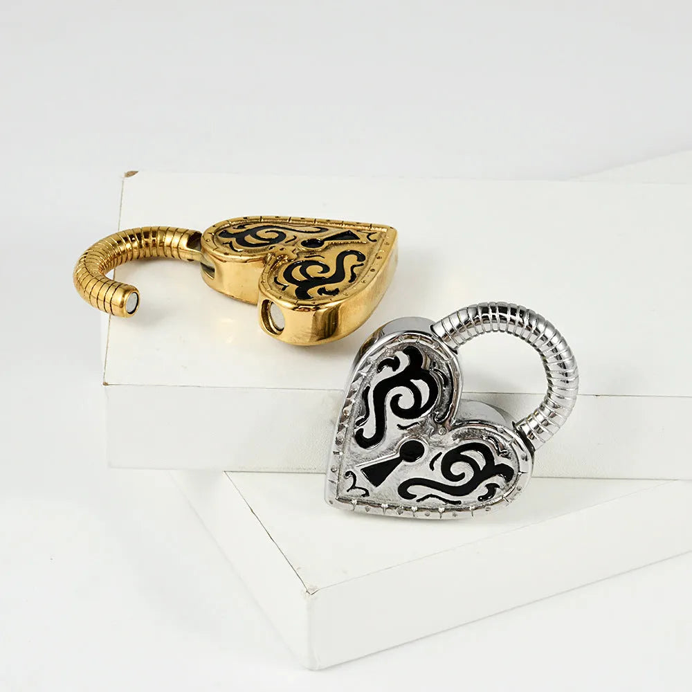 Close-up of a women's stainless steel heart-shaped ear piercing in a gold colour finish.