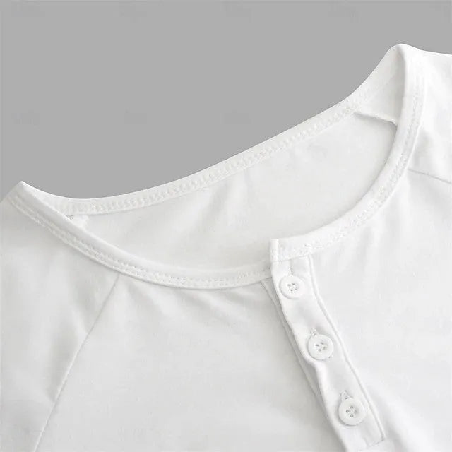 Man wearing a navy blue long-sleeved t-shirt with a henry collar, showcasing the European cut and cotton blend fabric.