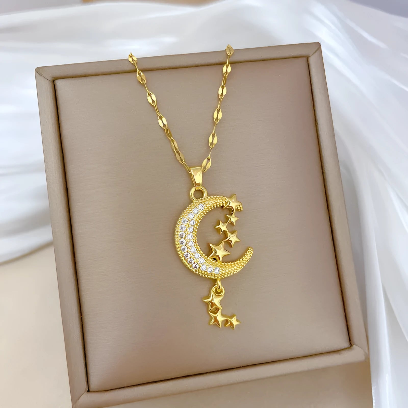 Moon pendant necklace with geometric tassel design and diamond arrangement on stainless steel chain