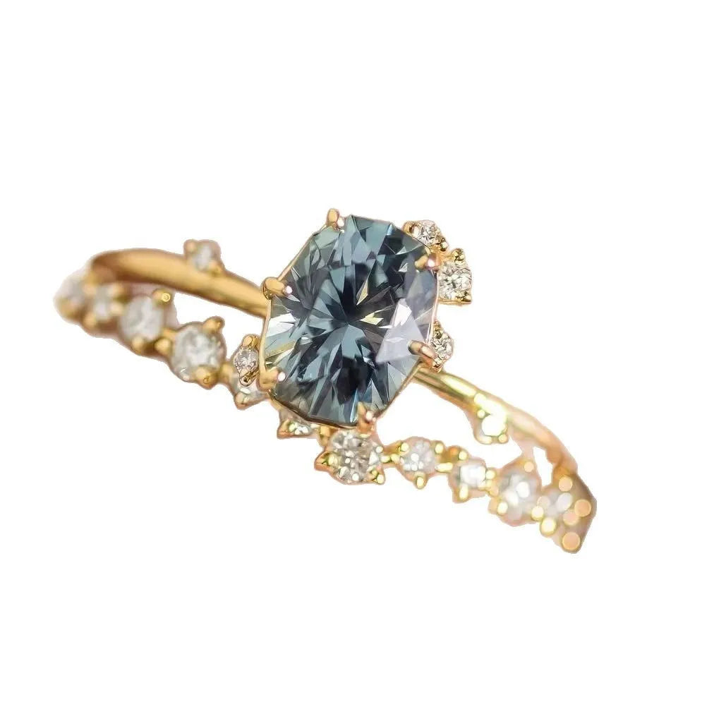 Gold plated women's flower ring with a green zircon stone, shown in sizes 6 to 10.