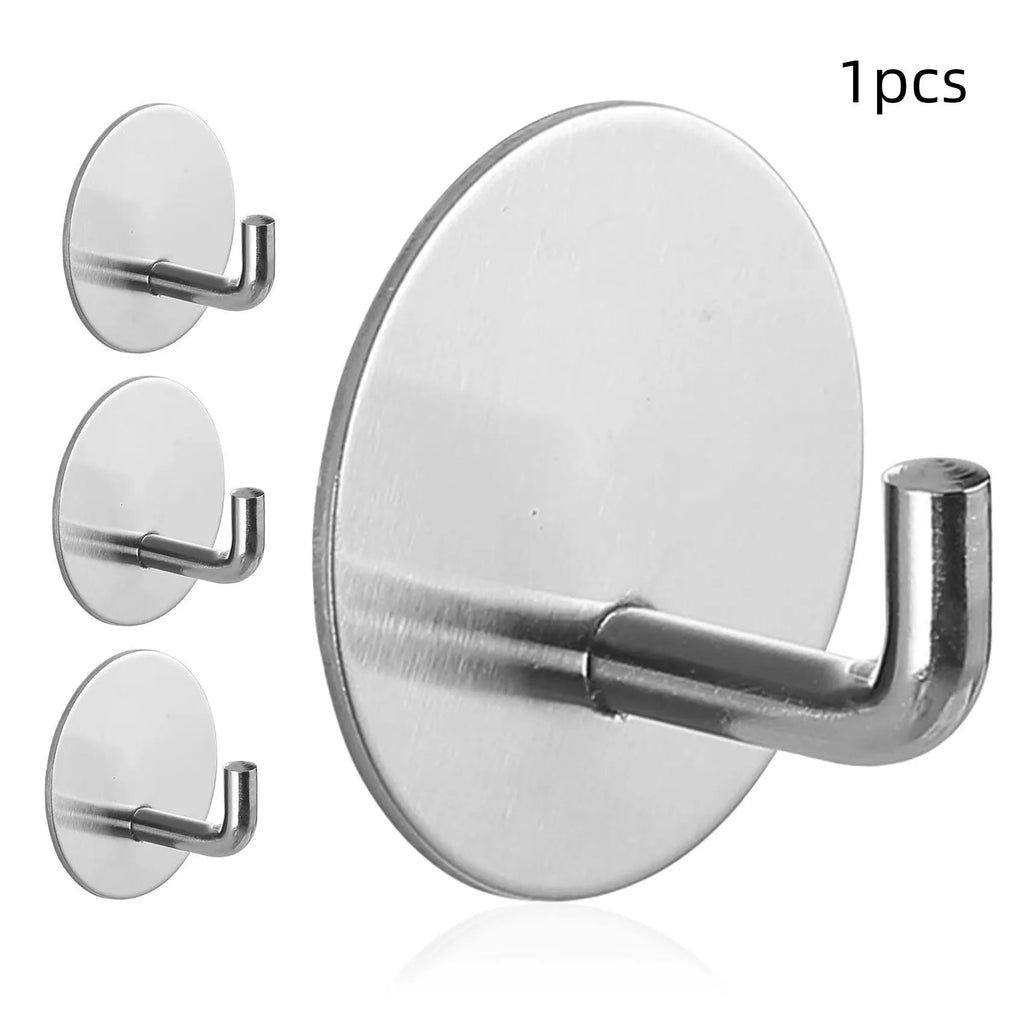Self-adhesive stainless steel round hook in black and polished finishes for wall mounting.