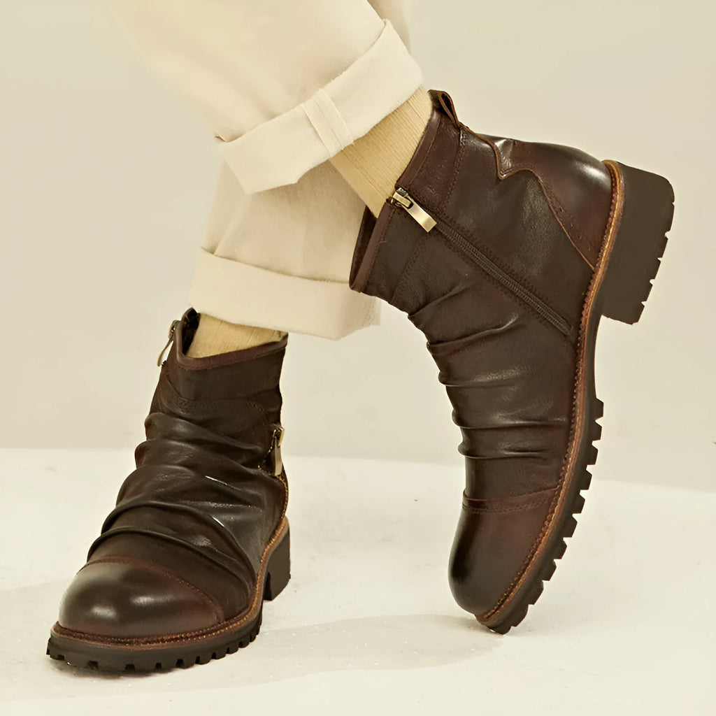 Brown mid-calf Martin boots with side zipper, embossed pattern, and a rubber sole with a mid-heel.