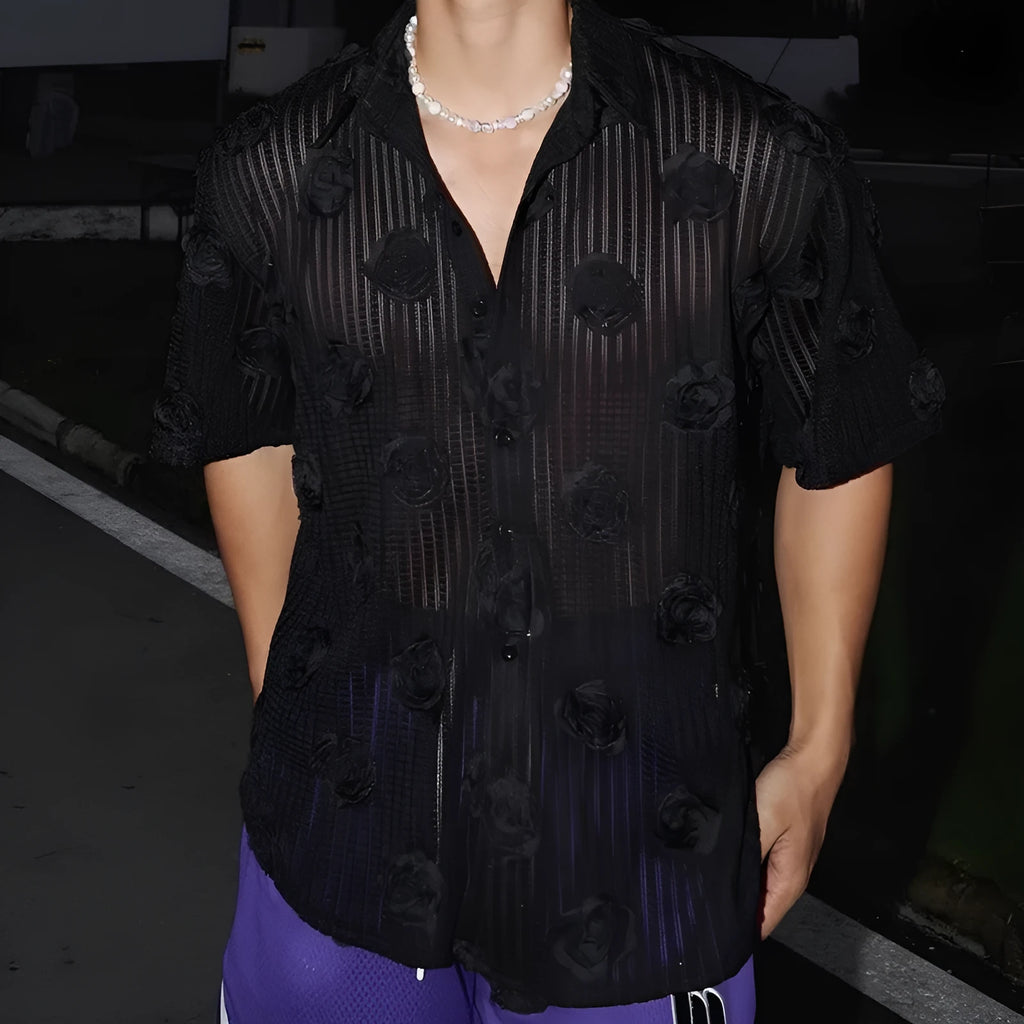 Plus-size model wearing a loose black short-sleeved shirt with a bold white three-dimensional floral print and a wool lining.