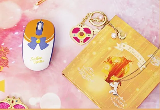 Sailor Moon pink cartoon wireless mouse with USB receiver on desk
