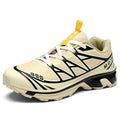 Men's and women's low-top artificial leather hiking shoes in multiple colours with flat rubber sole and lace-up front.