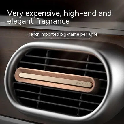Solid car aromatherapy ornament mounted on air vent with long strip design in metallic grey colour