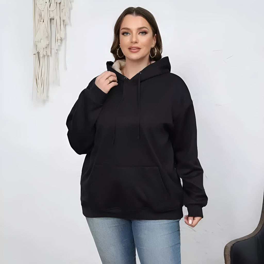 A woman's loose-fit hooded sweater with a raised 3D pattern, shown in a wine red colour.