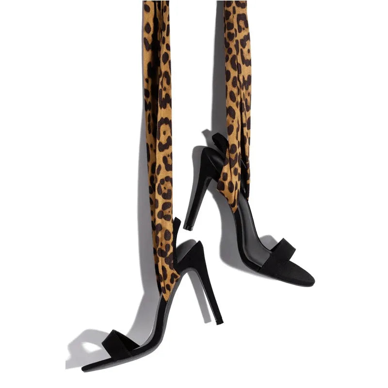 Light brown leopard print women's high heels with cross straps and a fine high heel