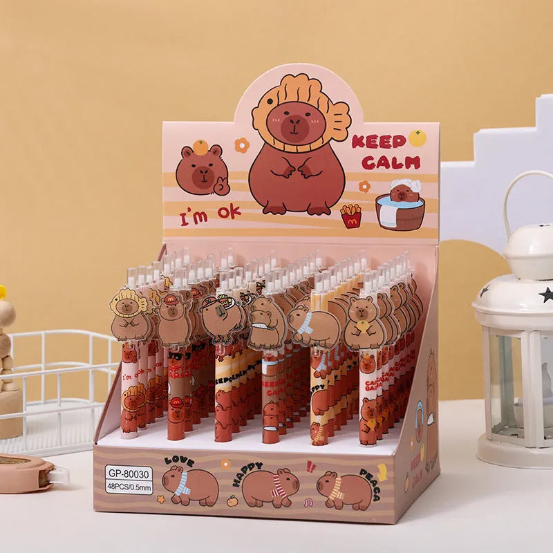 Box of 48 cartoon bear design acrylic gel pens with carbon black ink, showing the printed bear decoration on the pen barrels.