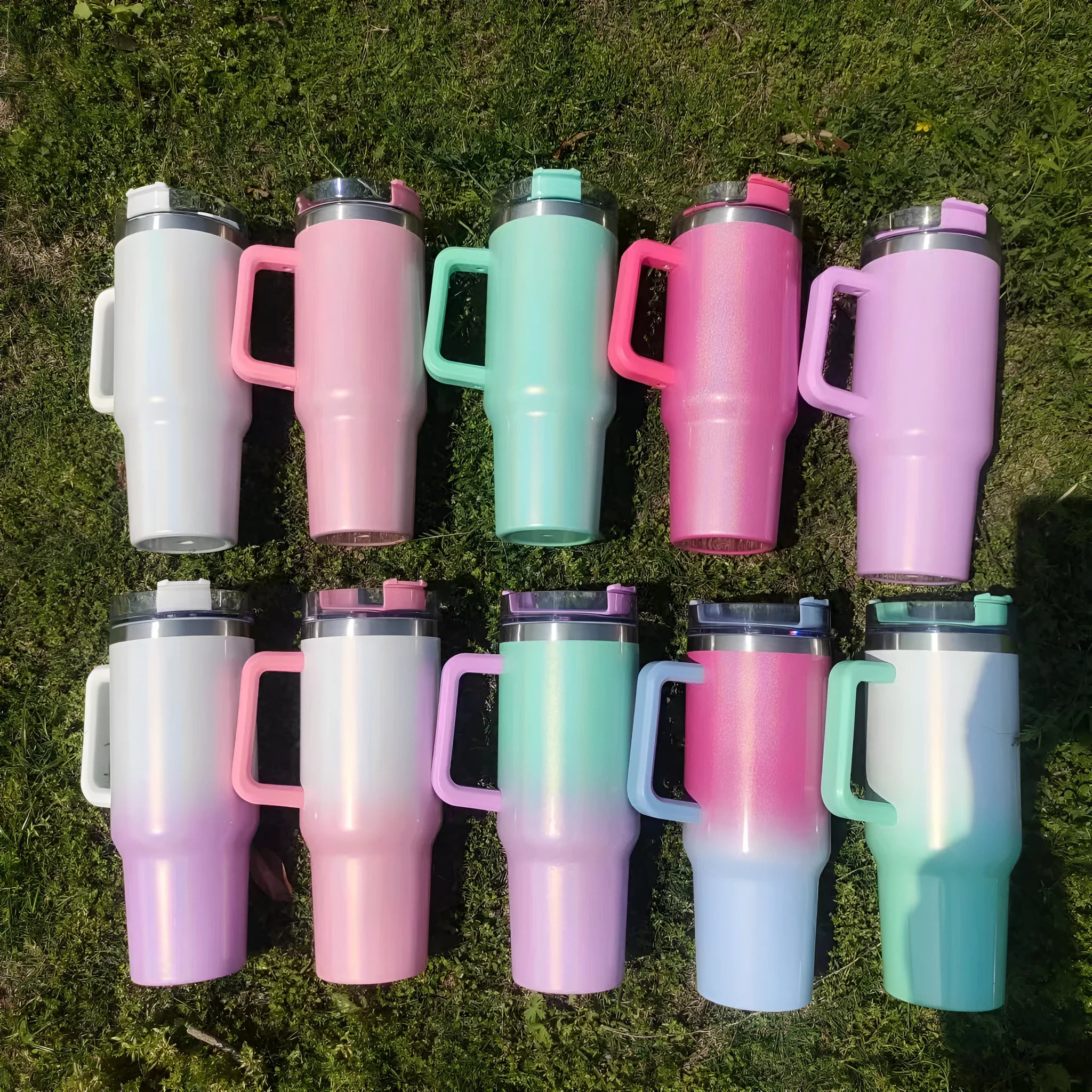 Large stainless steel vacuum insulation cup in a rainbow colour or gradient finish, showing its tall 27.5 cm height and wide 10 cm opening.