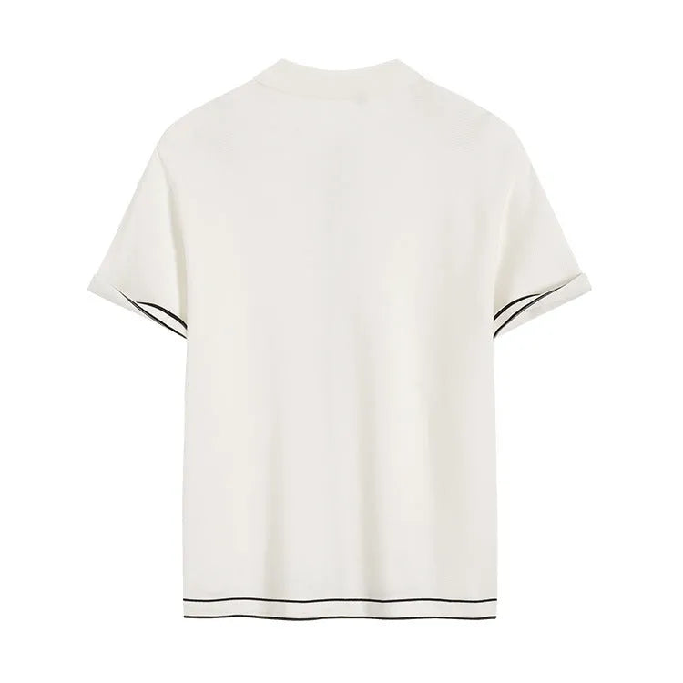 White short-sleeve cardigan with dark contrast lapels, laid flat.