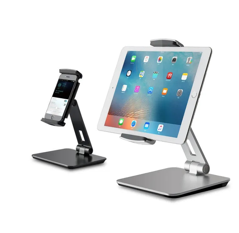 Black foldable aluminium phone and tablet stand with 360-degree rotation on a wooden desk