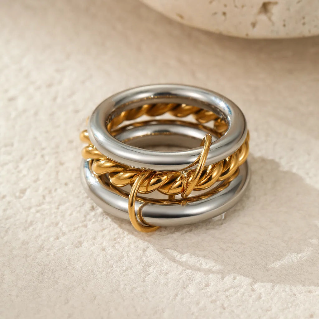 Stacked stainless steel rings with 18K gold plating in three colour options for women's hand jewellery