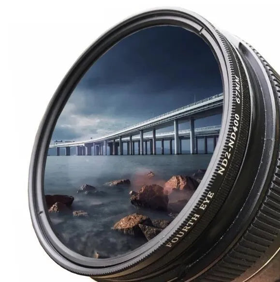 Set of four neutral density camera lens filters with multiple thread size adapters