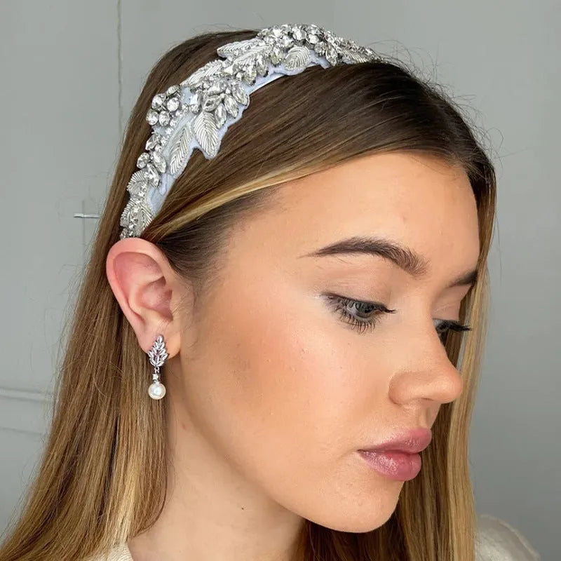 Geometric floral earrings with micro-set zircon stones in gold, platinum, or rose gold plating.