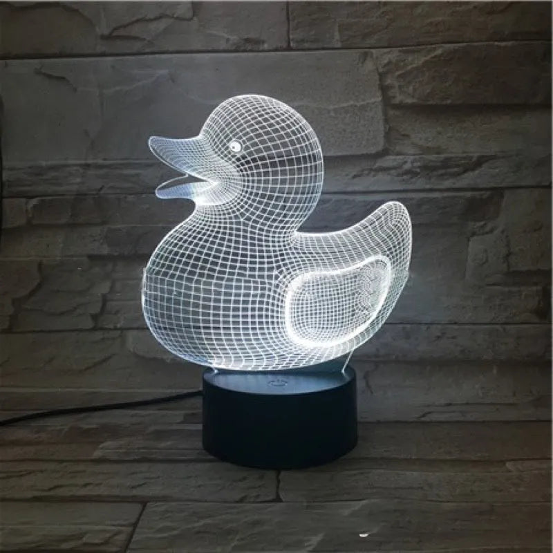 Little yellow duck 3D acrylic night light on ABS base with remote control, showing colour-changing LEDs.
