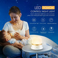 White bedside nursing night light with touch controls showing dimming and colour options