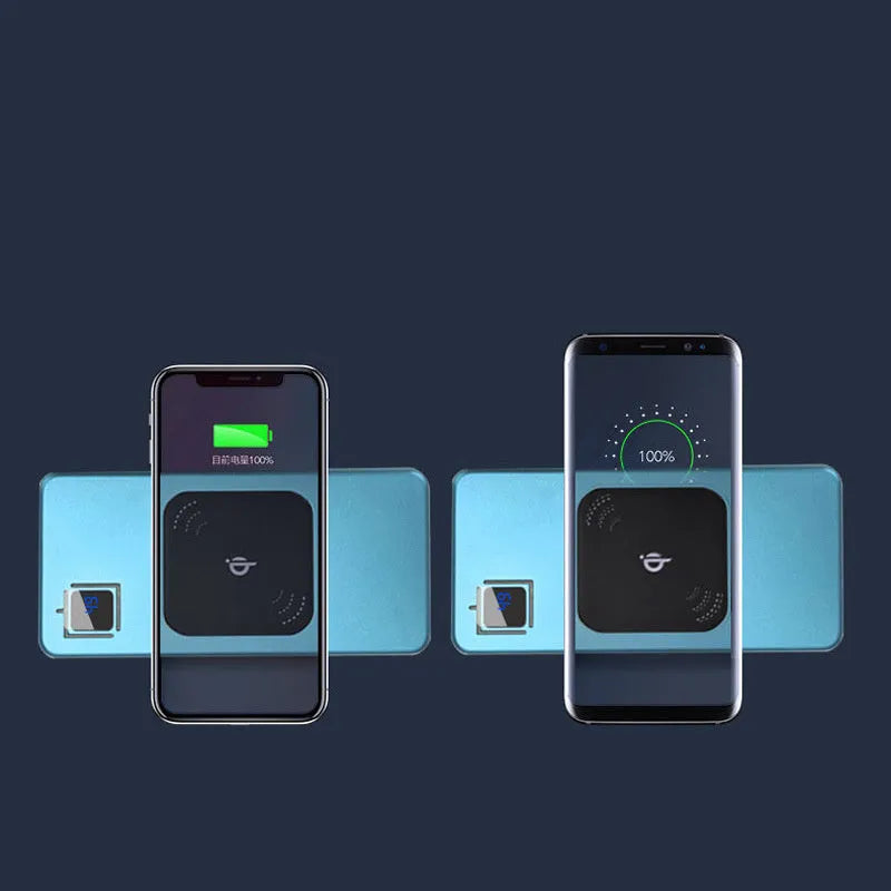 Silver portable power bank with LCD display showing battery percentage, placed next to a mobile phone.