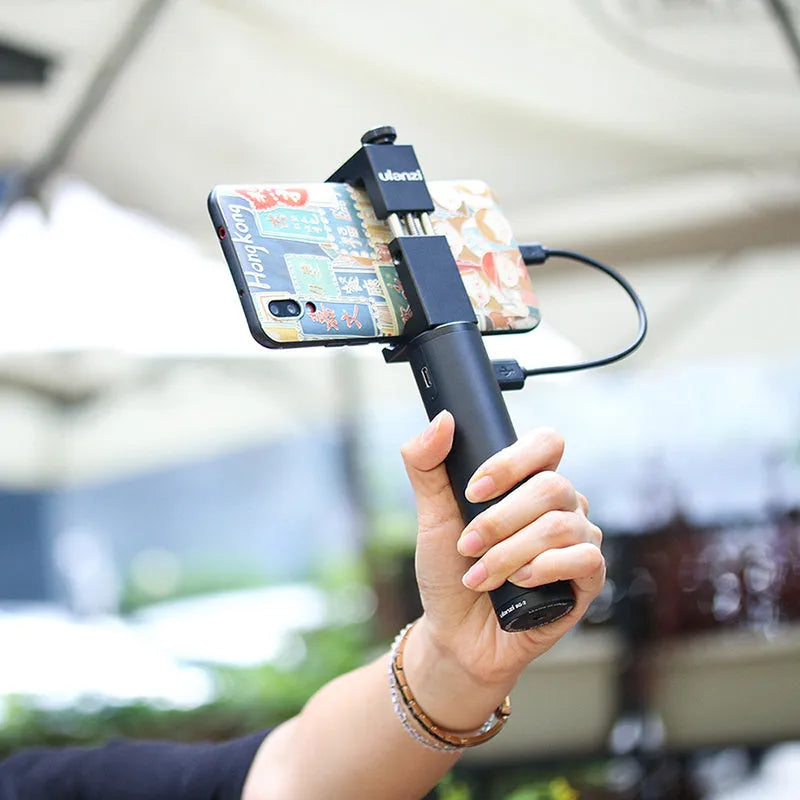 Black aluminium alloy portable power bank with an integrated handle, showing front view with scale.
