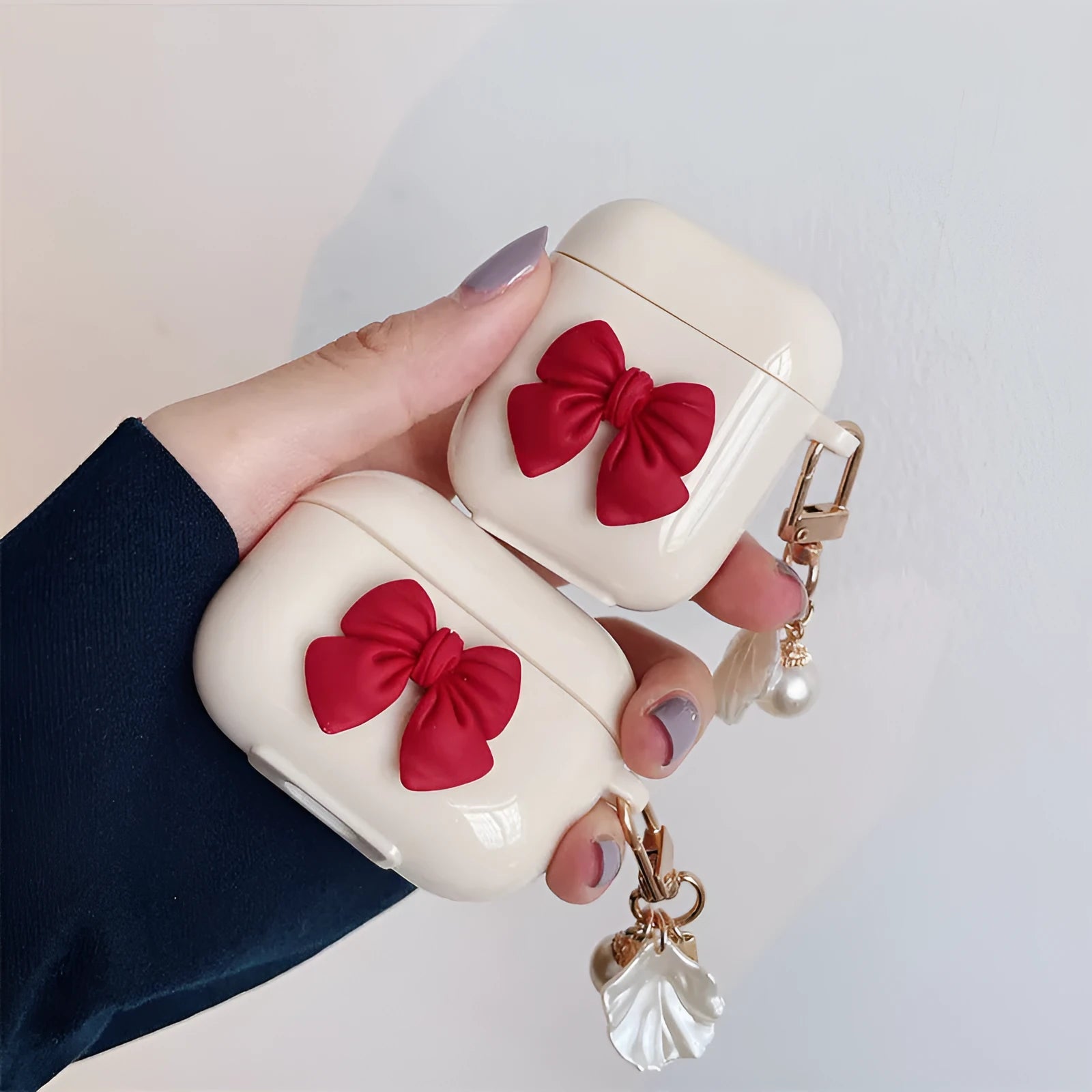 Beige red bow shell TPU AirPods case cover with clamshell design for AirPods 3, Pro 3, and 1/2 models