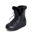 Women's black lace-up winter boots with a platform heel on a white background.