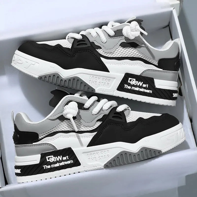 Men's white low-top board shoes with colour-matched details and rubber soles