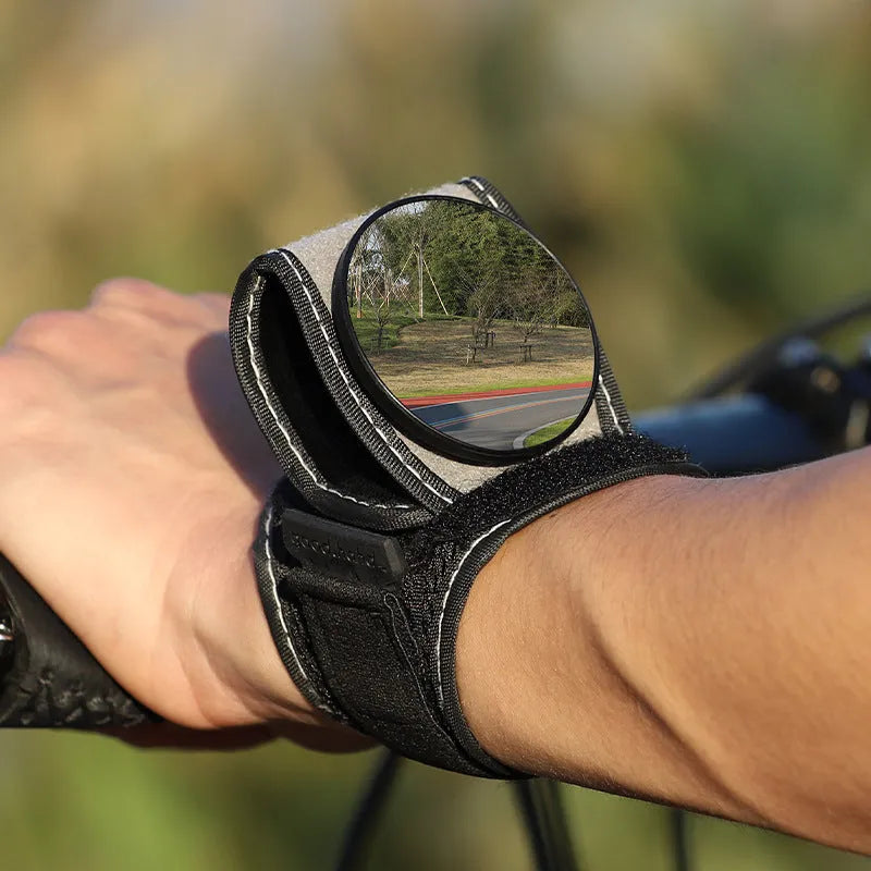 Black nylon bicycle rear-view mirror for wrist mounting during cycling