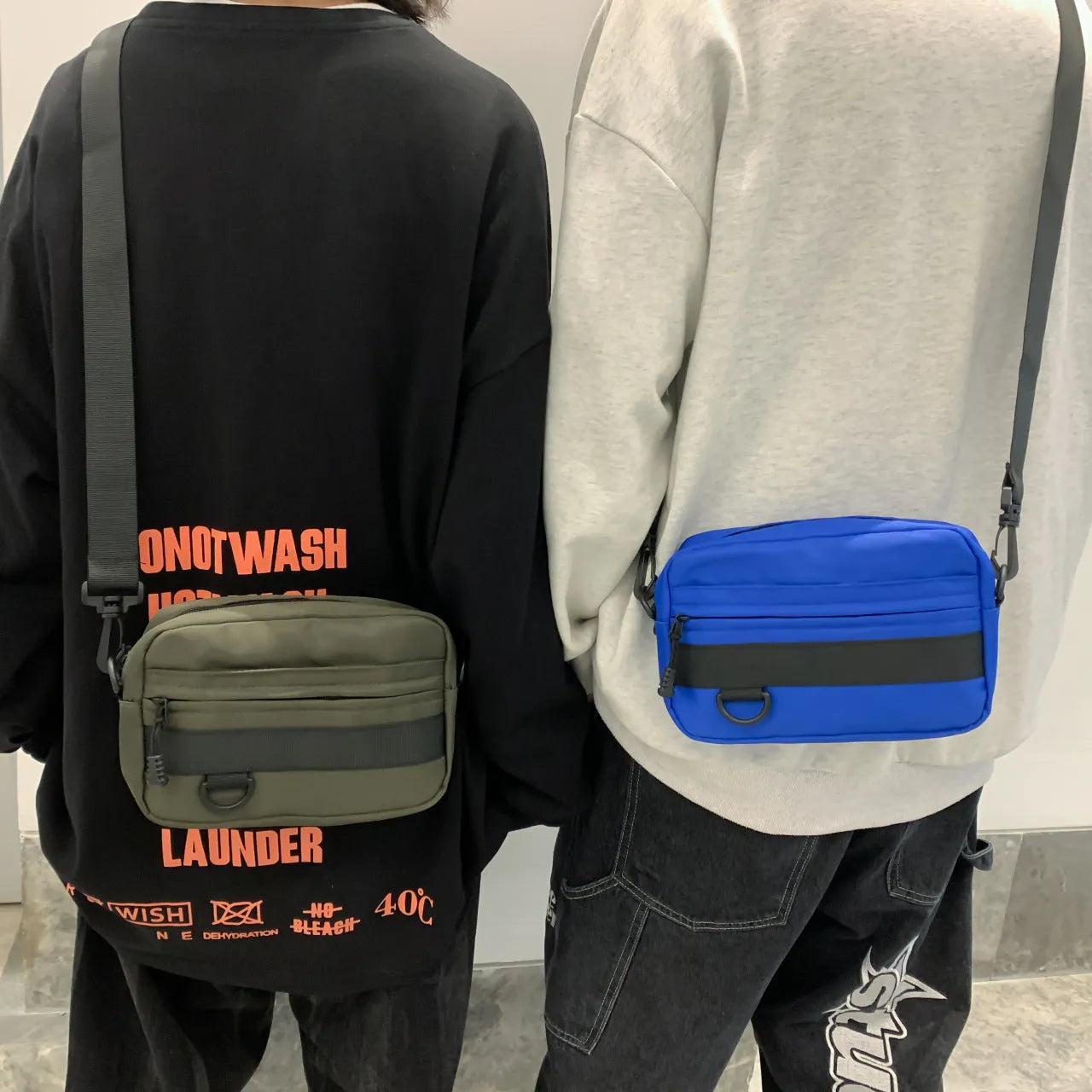 Men's street style nylon messenger bag in crossbody configuration with sewing thread detailing