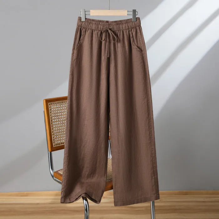 Women's apricot straight-leg casual trousers with elastic waist and lace-up detail.