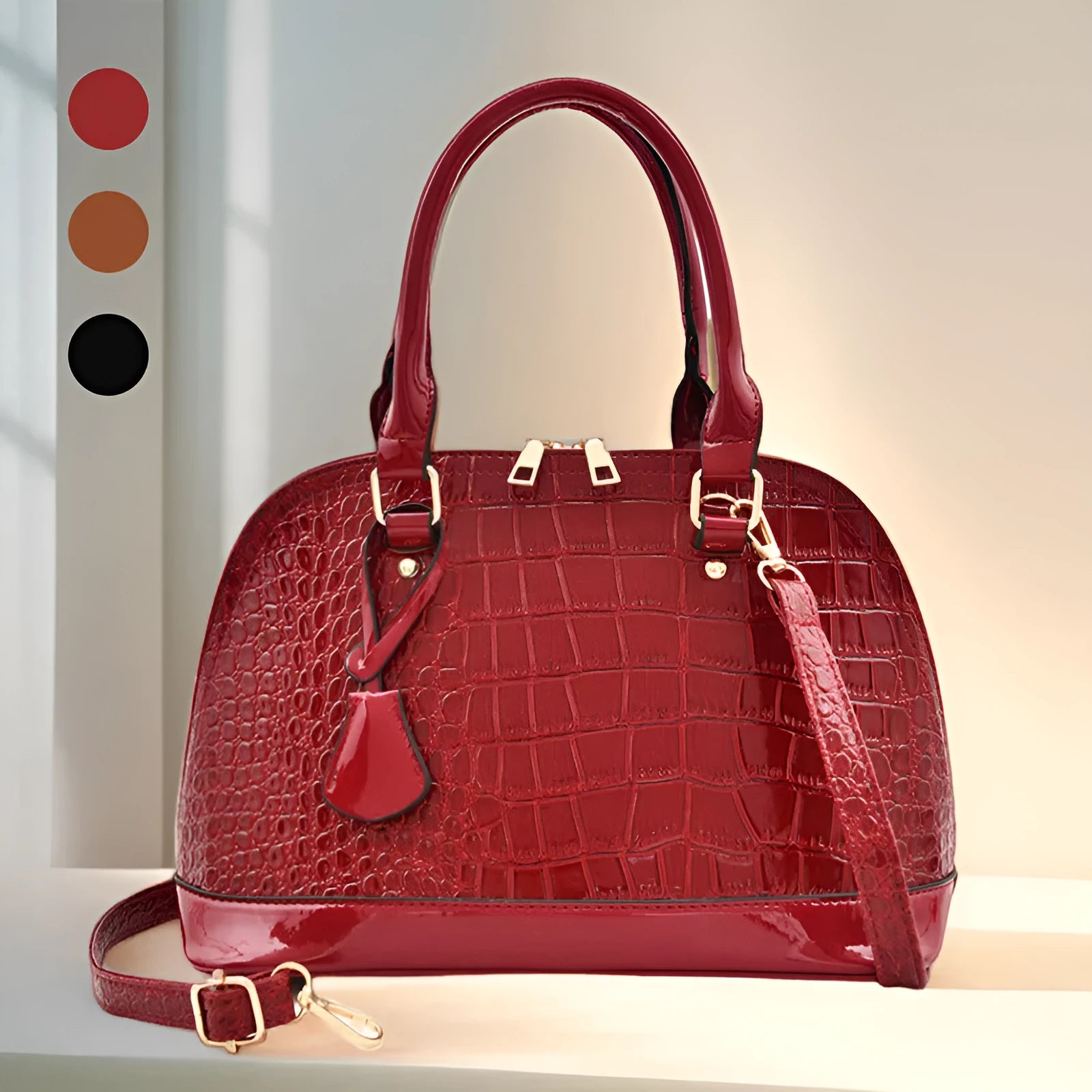 Large shiny PU leather crossbody shoulder bag in shell shape, showing black, red, and brown colour options