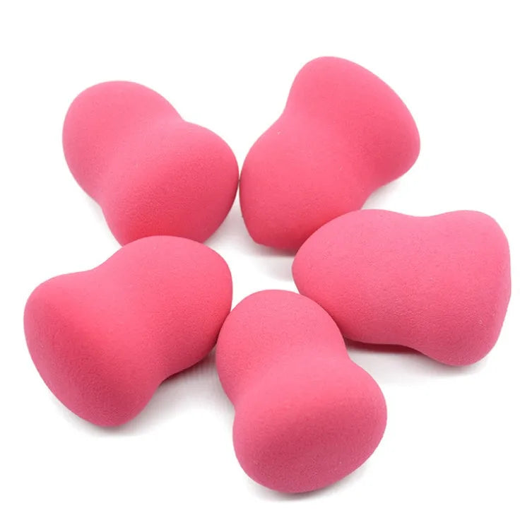 Pink makeup foundation sponge with hydrophilic non-latex material measuring 4cm by 4cm by 5.6cm