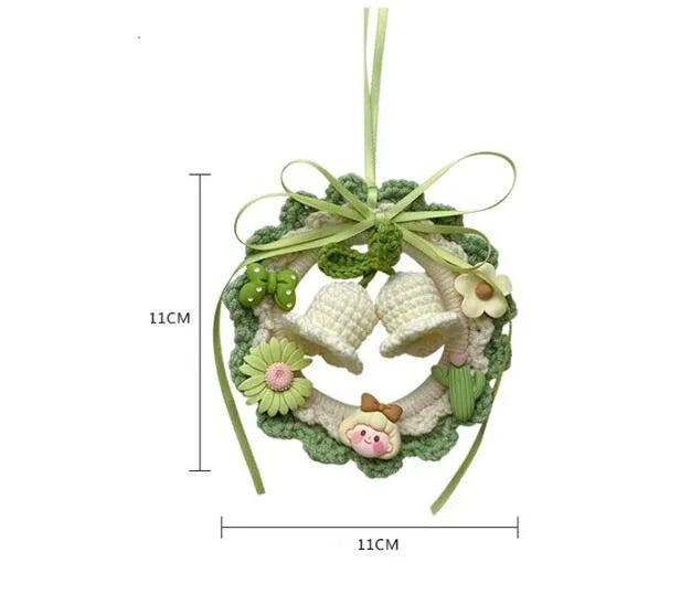 Handmade woven bell orchid car pendant in wool, shown in green, pink, purple, and yellow colour options.