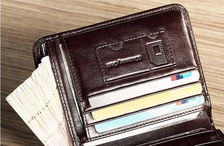 Men's black leather wallet open to show internal card slots, coin pocket, and document sleeve.