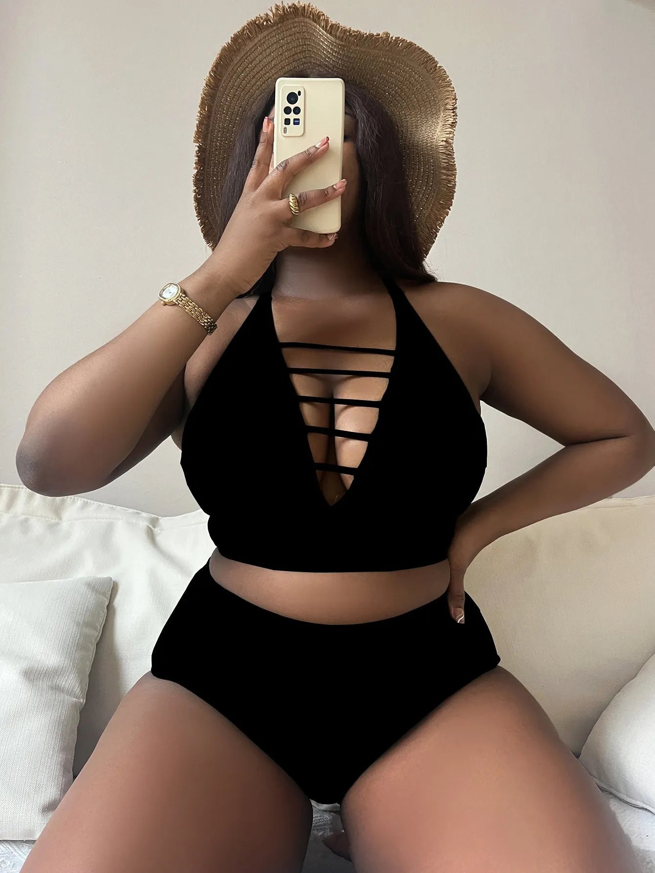 Plus size woman modelling a black adjustable halter bikini with high waist briefs