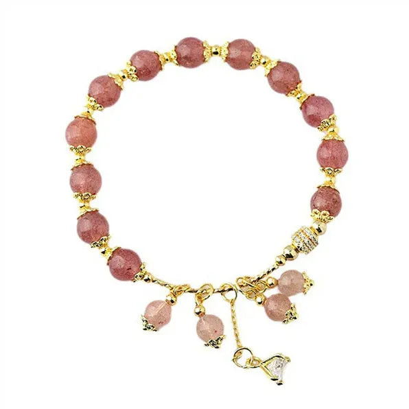 Pink women's bracelet with heart-shaped strawberry quartz crystals and pearl bead accents on adjustable band