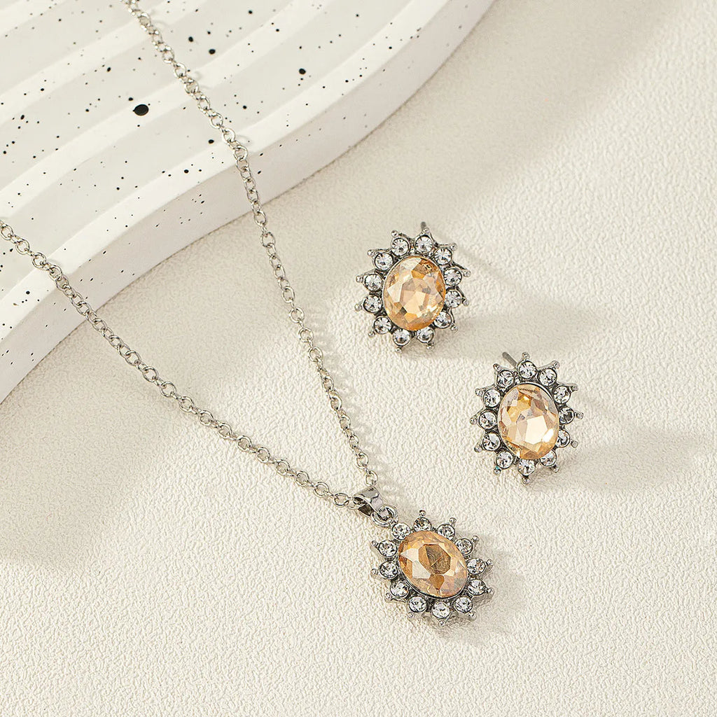 Sunflower zircon necklace and earrings set in alloy with electroplated finish showing six colour options