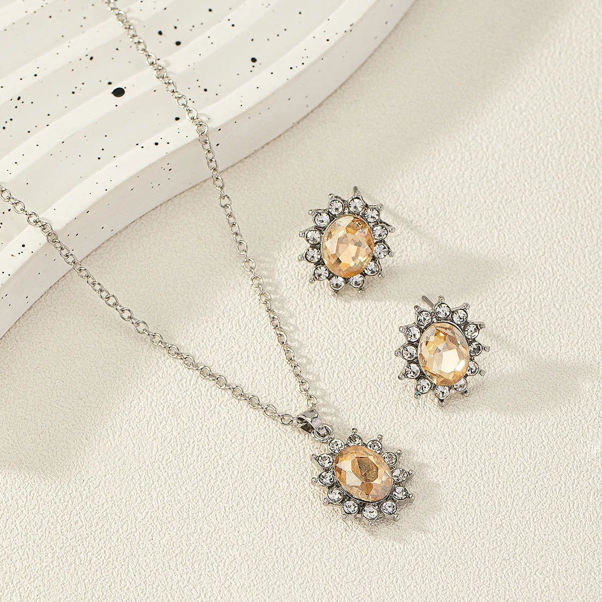 Sunflower zircon necklace and earrings set in alloy with electroplated finish showing six colour options