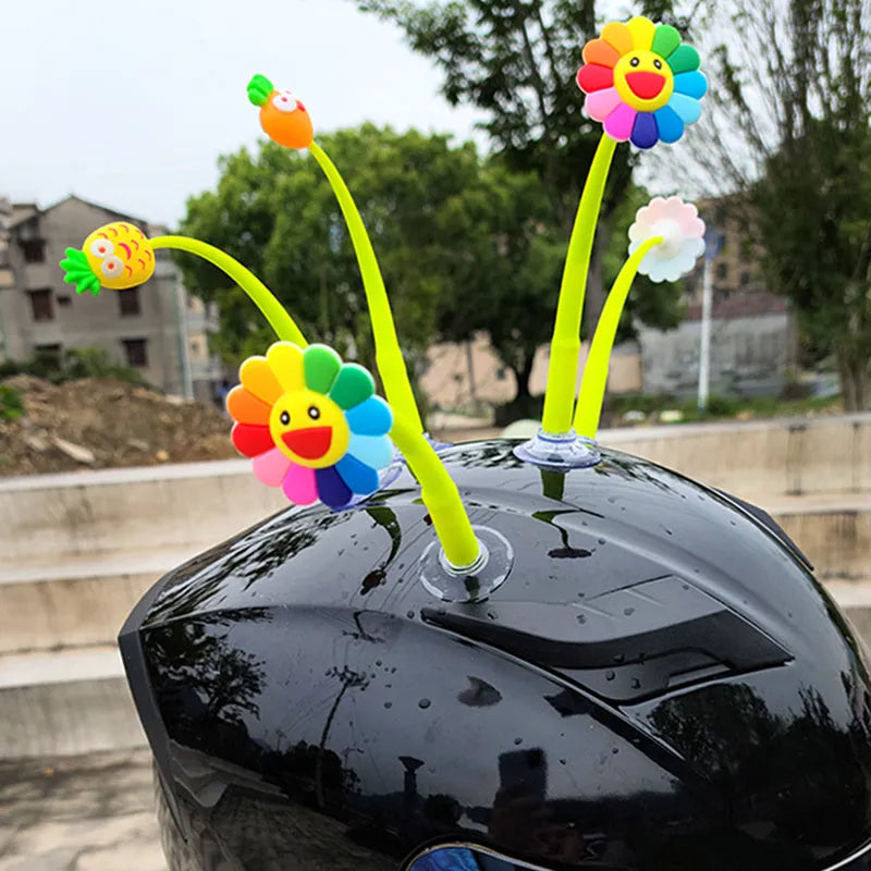 Swinging silicone sunflower decoration with suction cup for motorcycle or bicycle helmet.