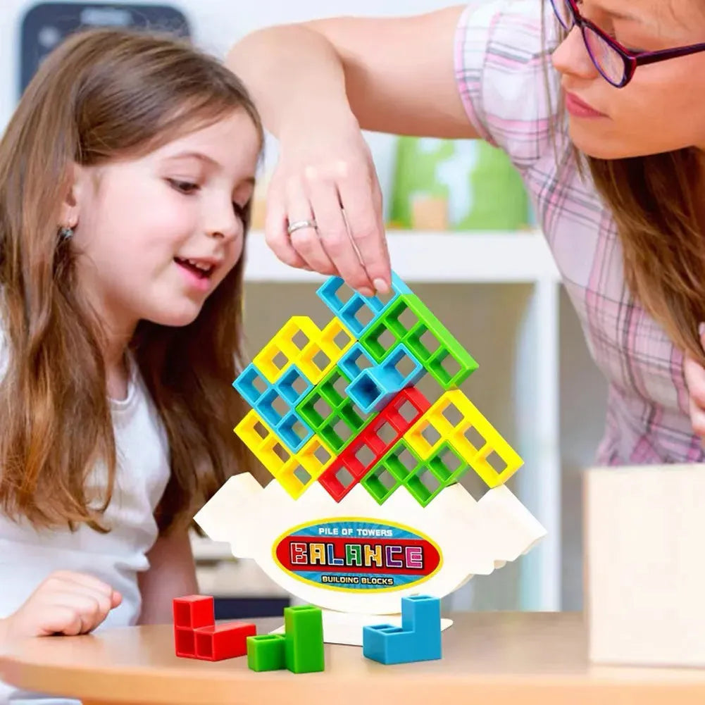 Plastic balance stacking board game with 16 colourful blocks on a chassis and base