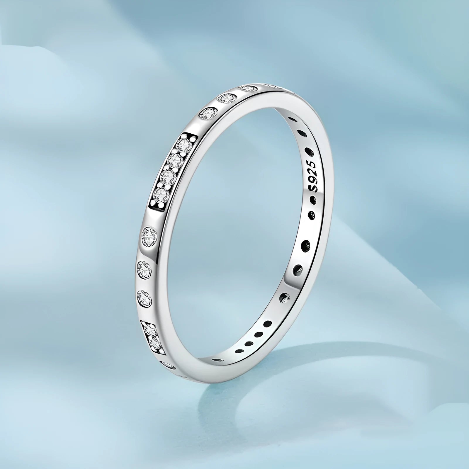 Simple silver Moss Password I Love You ring with oxidised black finish, shown on a model's finger.